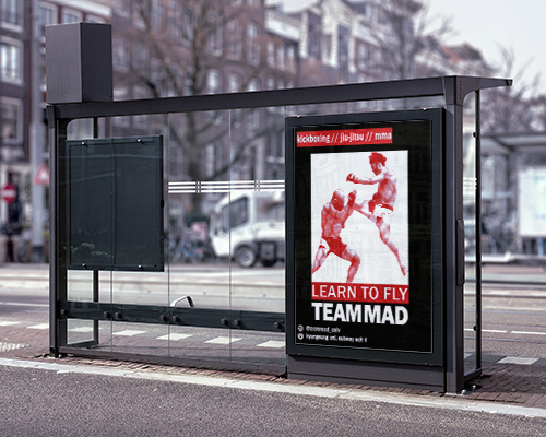 Team MAD marketing poster at a bus stop